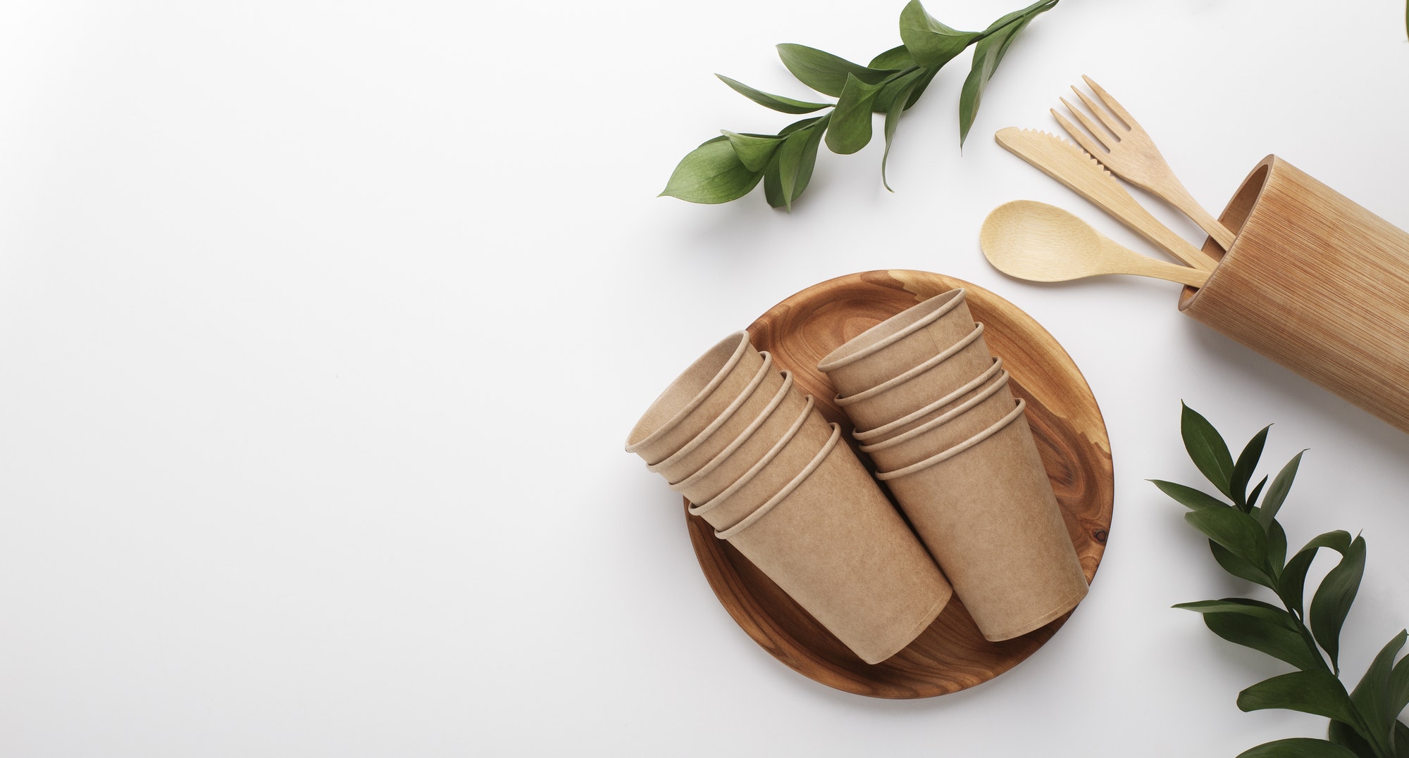 Paper cups, wooden plate and cutlery tools
