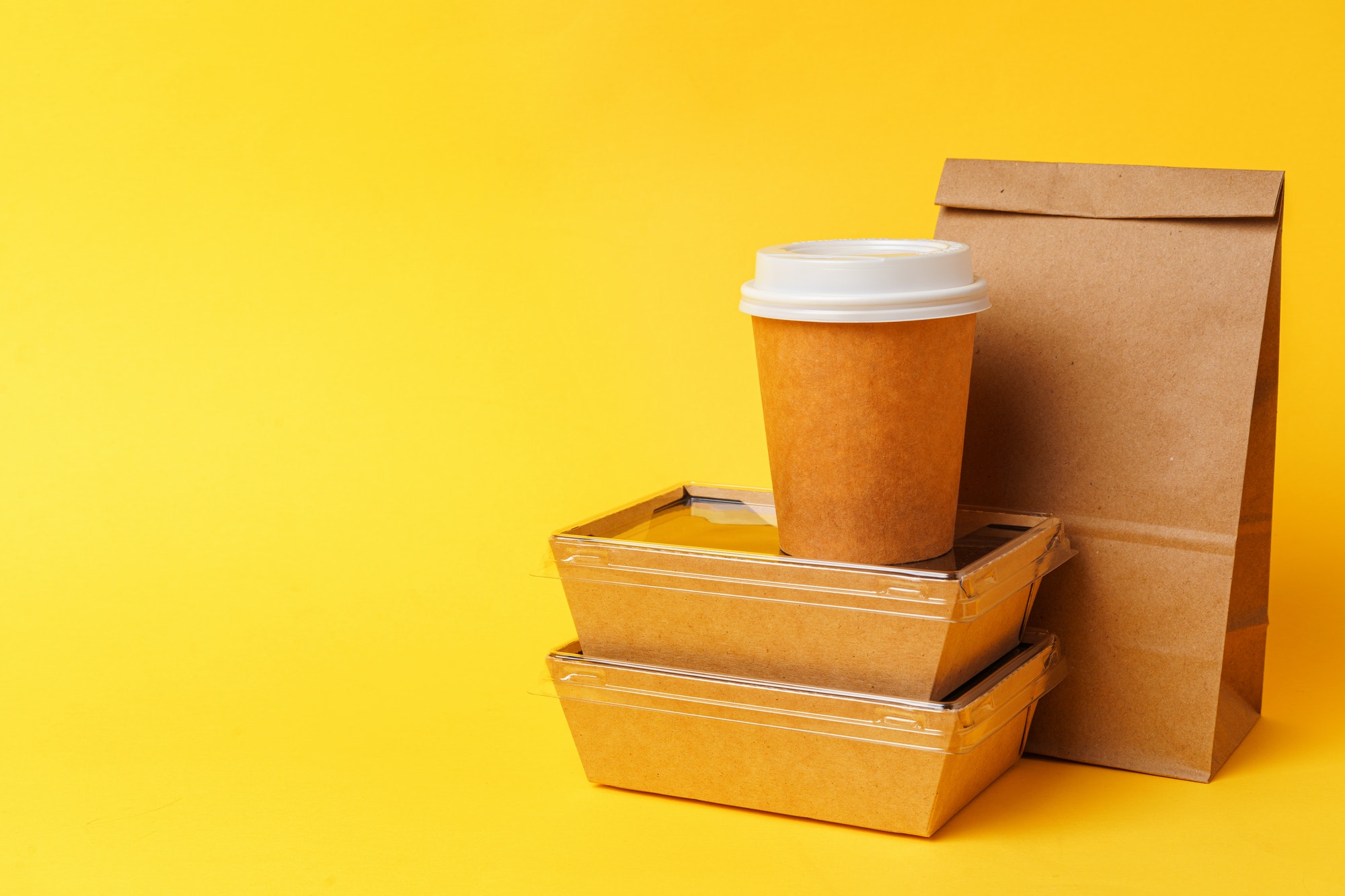 Takeaway food concept. Some packed food in container with coffee cup